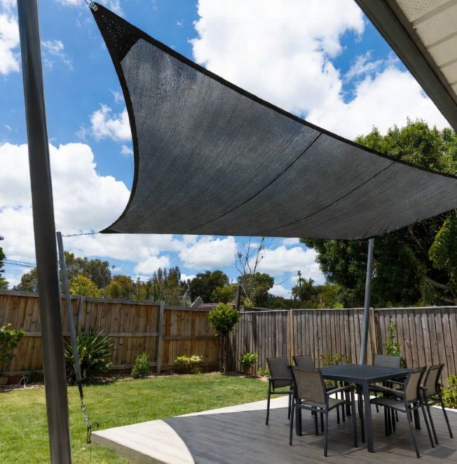 large triangular shade sail made of breathable screen fabric